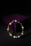 Multicolored beaded bracelet on a dark background