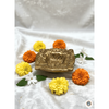 Square-shaped polished brass diya with a deep central oil reservoir and a notched corner for the cotton wick