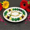 Colorful beaded bracelet on a white plate with flowers around
