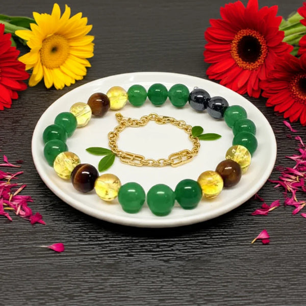 Colorful beaded bracelet on a white plate with flowers around