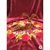 Golden Om diya lamp on red velvet with arranged red rose, yellow and white flower petals