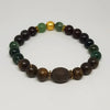 Beaded bracelet with green, brown, and gold beads on a white background