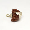 A rare, nearly spherical 1 Mukhi Rudraksha bead with one continuous vertical groove running from top to bottom. The surface is densely packed with natural 'thorny' protrusions characteristic of high-quality Himalayan beads