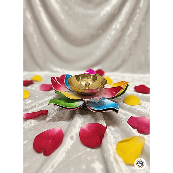An ornate brass oil lamp designed as a blooming flower with colorful decorative petals
