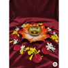 Flower-shaped brass diya with five orange enamel-coated petals and a central gold-tone oil reservoir