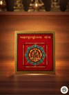 Decorative book or plaque with religious design on a wooden surface