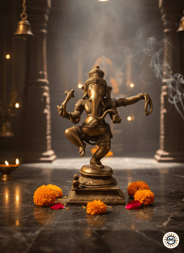 Bronze statue of a deity on a dark surface with flowers and smoke