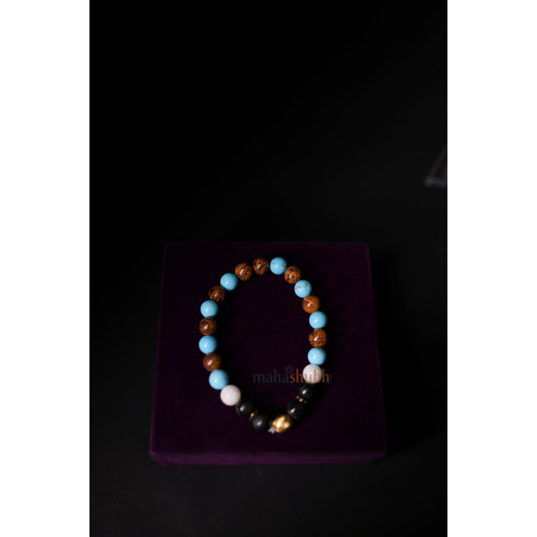 Beaded bracelet on a purple velvet stand with 'mahashri' branding against a dark background