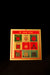 A colorful booklet with a diagram for each planet in astrology, titled 'Shri Navgrah Yantra' in a vibrant font on a dark background.
