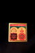 A colorful poster or card with Hindi text and an illustration of two figures, one seated and the other standing, enclosed within a rectangular frame with a gold border.