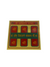A book cover of a Vashikaran Yantra with a gold background and red and green text.